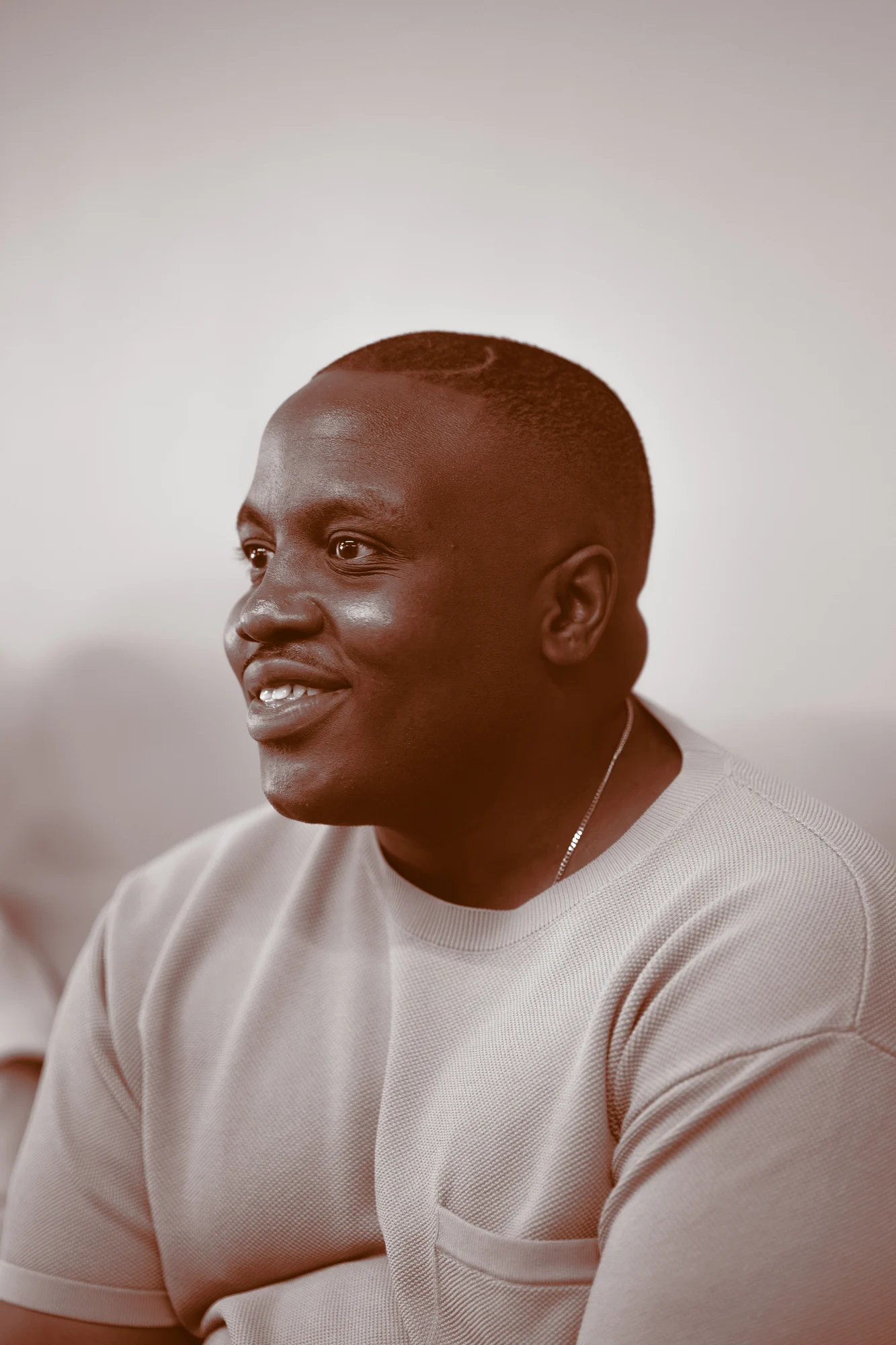 Portrait of a smiling person against a light background
