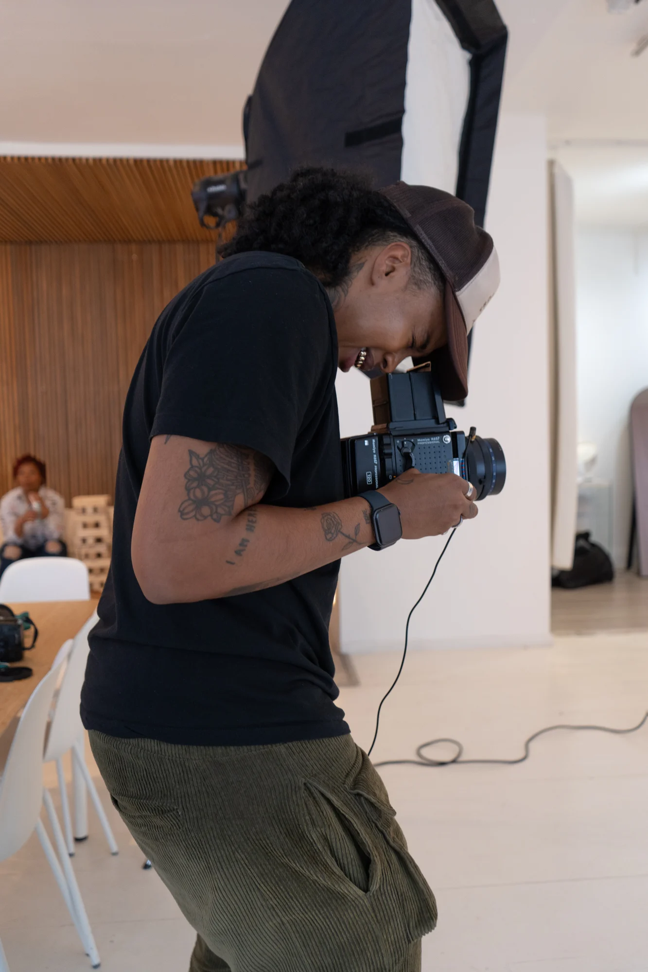 A photographer checking their camera during a production
