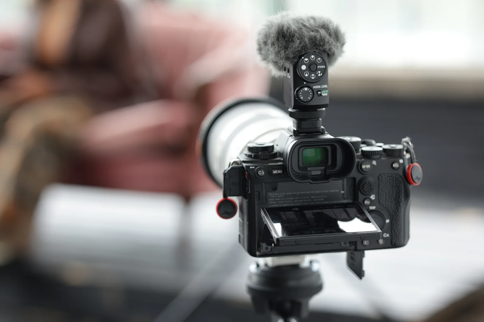 Camera with a microphone on a tripod during an interview
