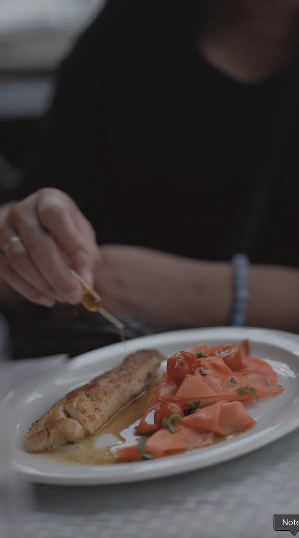 Food and hands at the event table