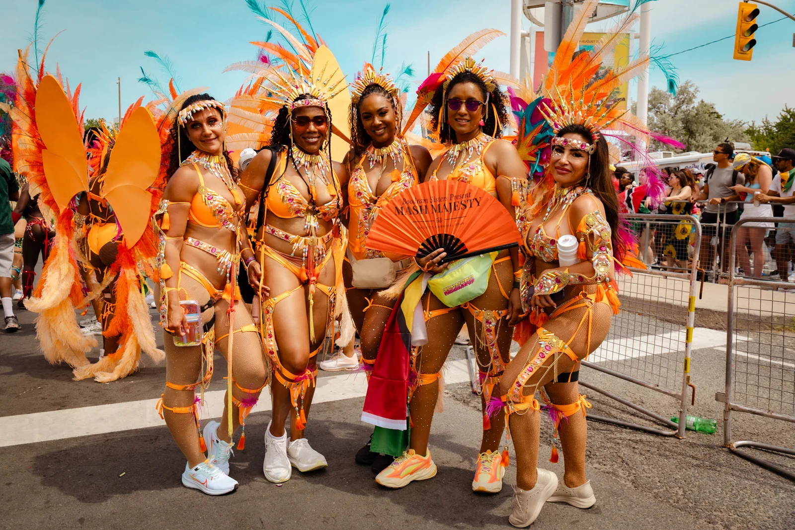 Mash Majesty group gathered in orange costumes