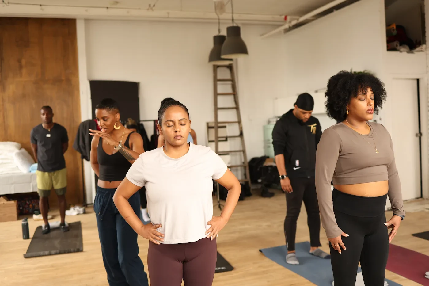 Masterpeace participants moving together in a studio
