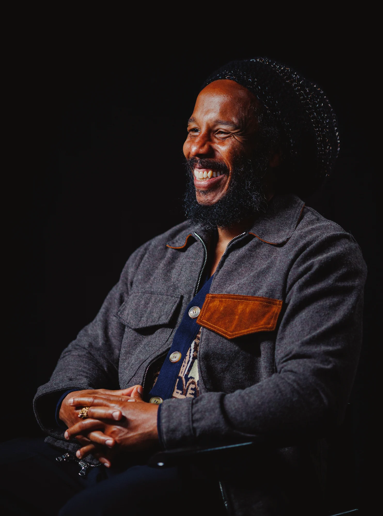 Person smiling while seated