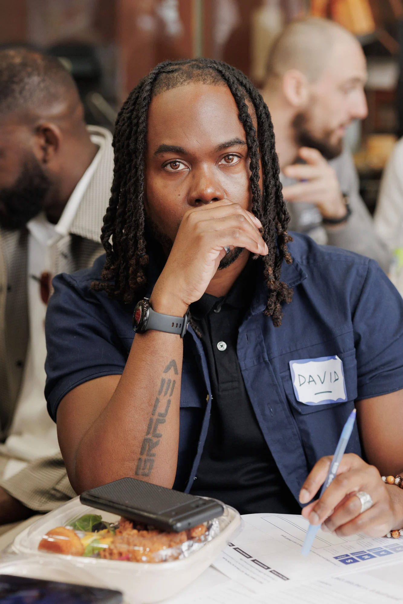 Participant seated at an event table