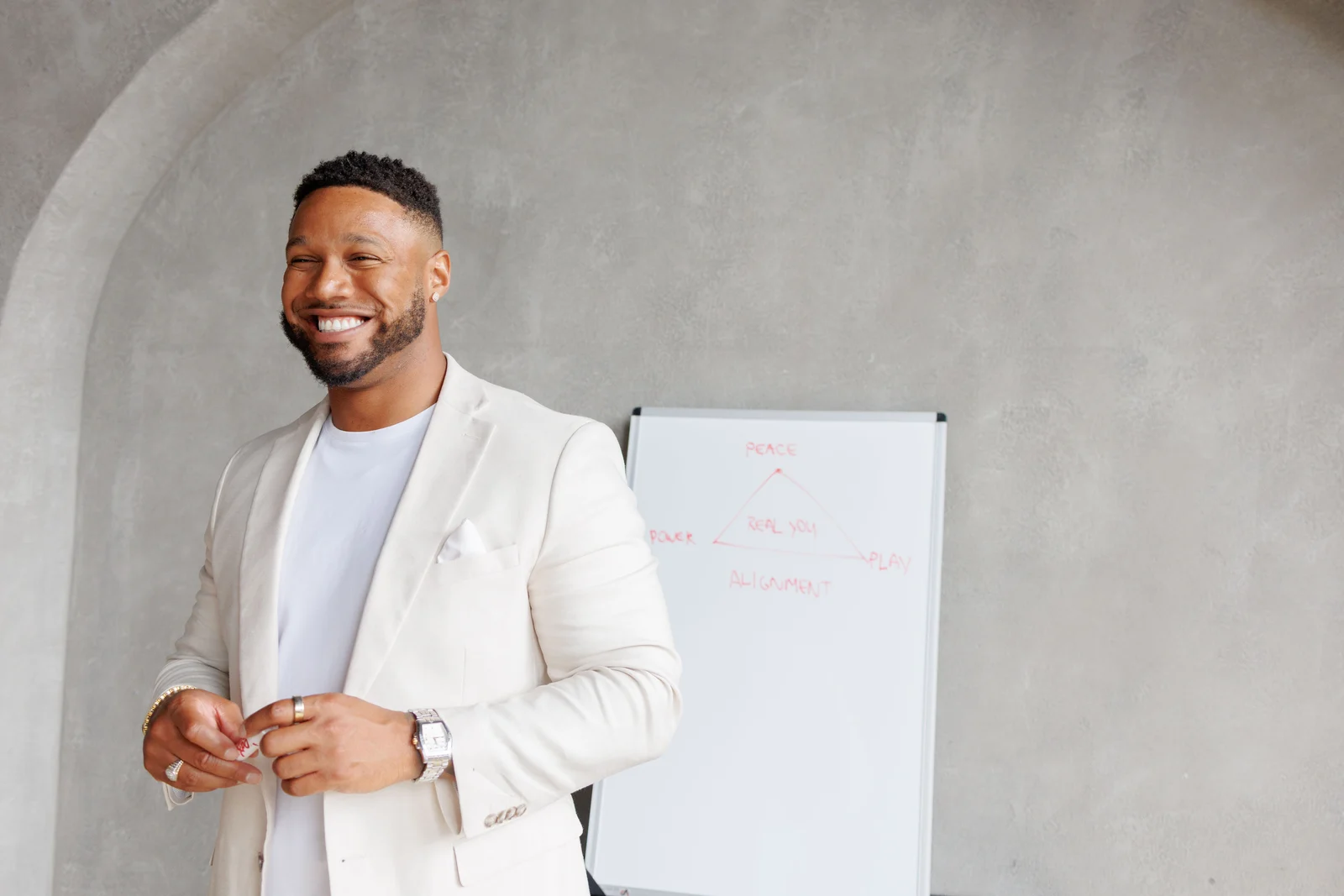 Tychon Carter-Newman beside a studio whiteboard